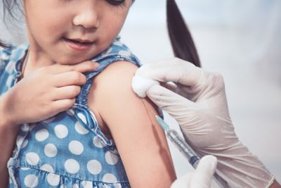 A child receiving a vaccination shot