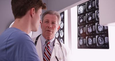 A doctor explaining the link between fundamentalism and brain damage