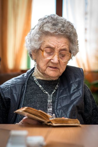 Older Woman Reading a Bible