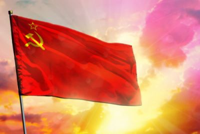 A Soviet flag flying surrounded by divine light