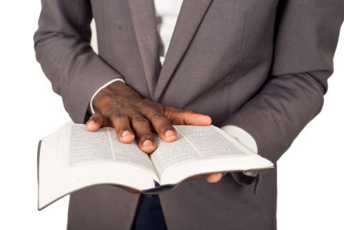 Spiritual Leader Holding a Bible