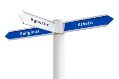 A sign pointing toward agnosticism, atheism, and religious theism