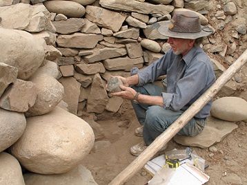 Archaeologist with stones