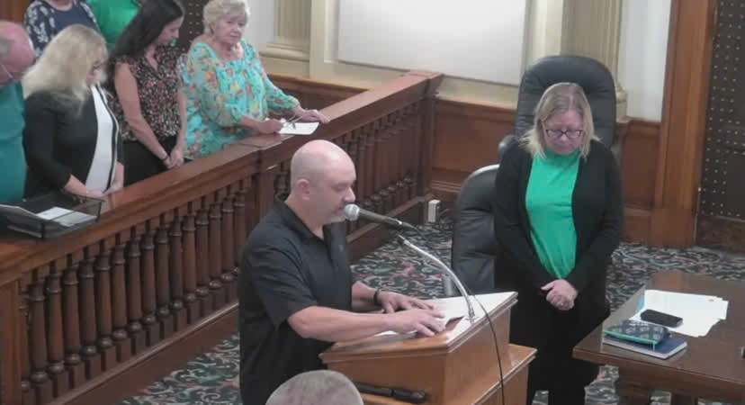Former Ottumwa City Council member Matt Dalbey delivers a Satanic invocation during a council meeting in Iowa, sparking controversy over religious freedom.