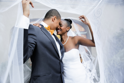 Bride and groom smiling together.