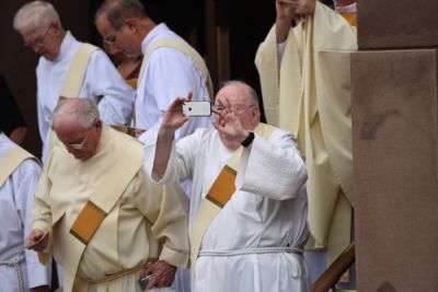 Clergy Holding Cell Phone