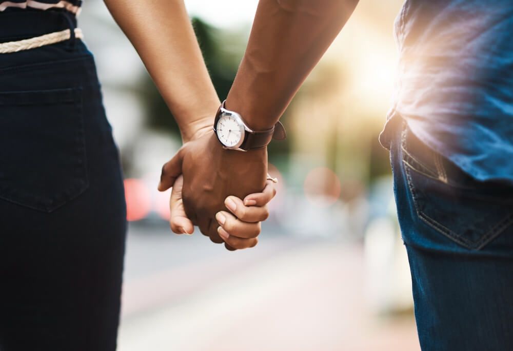 Couple holding hands