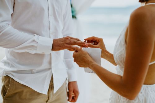 Man and Woman Exchanging Rings After Vows