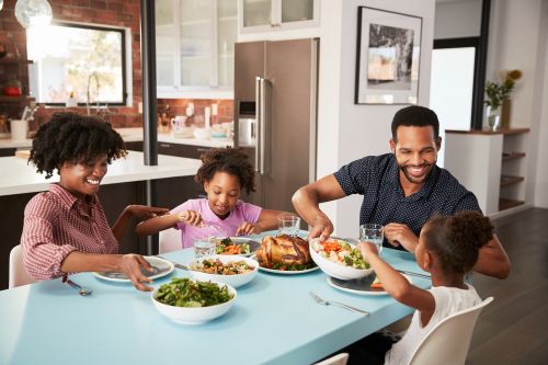 A family sitting together at the dinner table