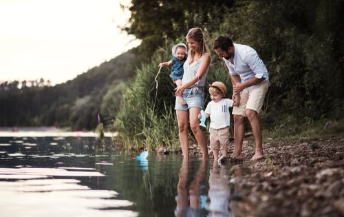 Family on a Riverbank