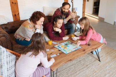 A Family Playing a Board Game