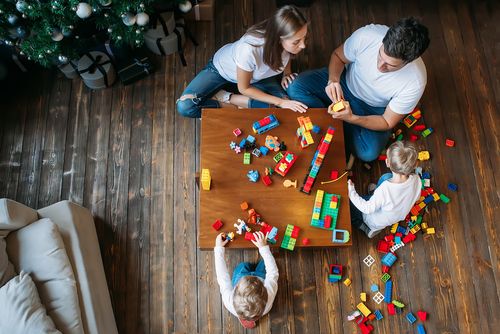 A family with focus on playing together rather than cleaning