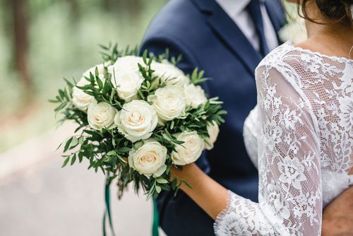 Groom and Bride Standing Close Together