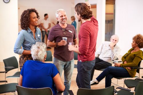 Group of Neighbors Socializing In Their Community