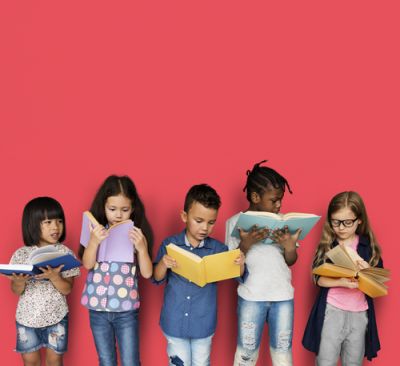 A group of children reading for Arab American Heritage Month