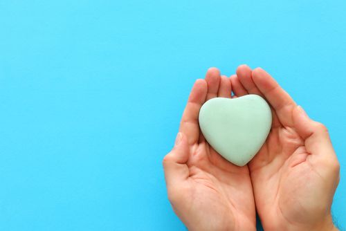 Hands Holding a Blue Heart