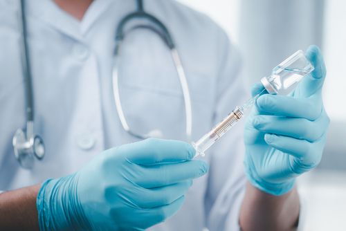 Health Care Worker Readying a Vaccine