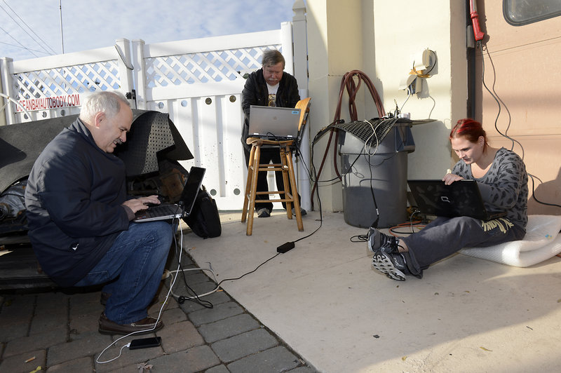 New Yorkers charging cell phones and latops in the wake of Hurricane Sandy