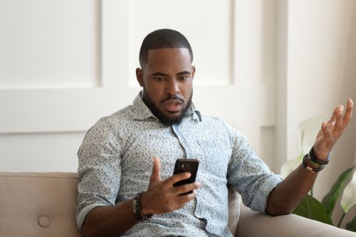 Man Looking at His Phone