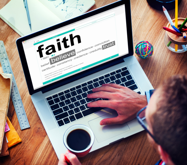 Man about to spill coffee on his laptop