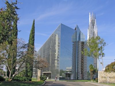 A glass megachurch looming over the street