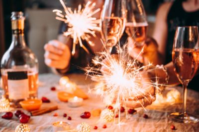 A group of people celebrating the new year with champagne and sparklers