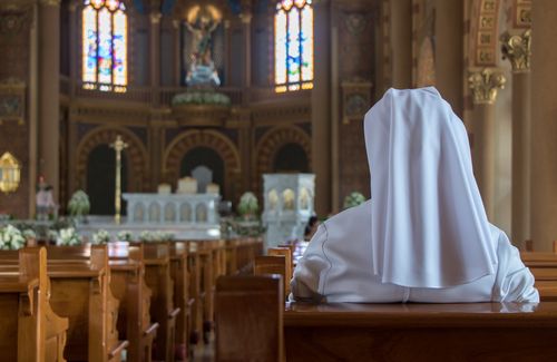 Nun in a Catholic Church