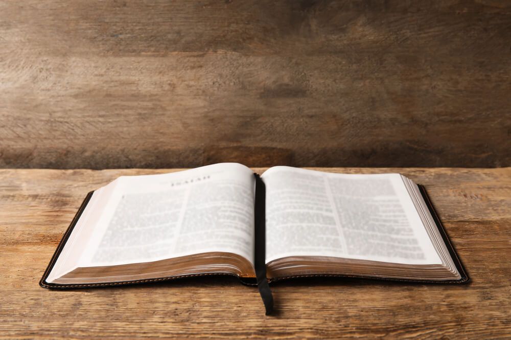 Open scriptures on a table.