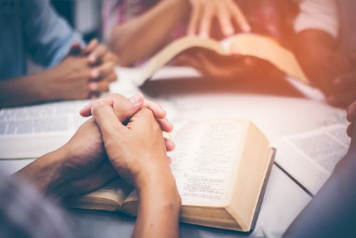 A group studying the Bible