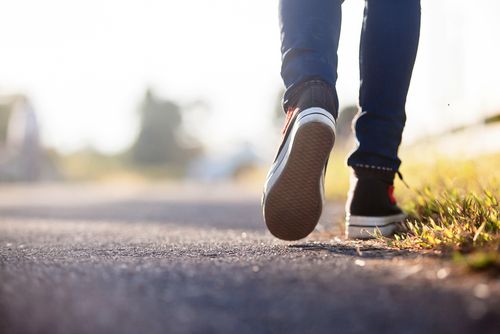 Person Getting Their Steps In bWalking on a Trail