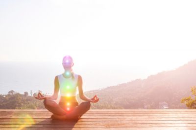 A person with multiple auras meditating