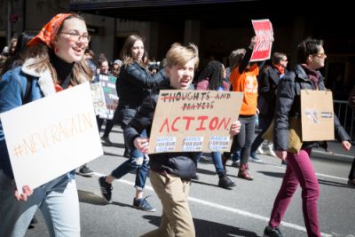 Protesters criticizing thoughts and prayers inaction