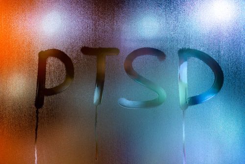 PTSD written on the fog of a window