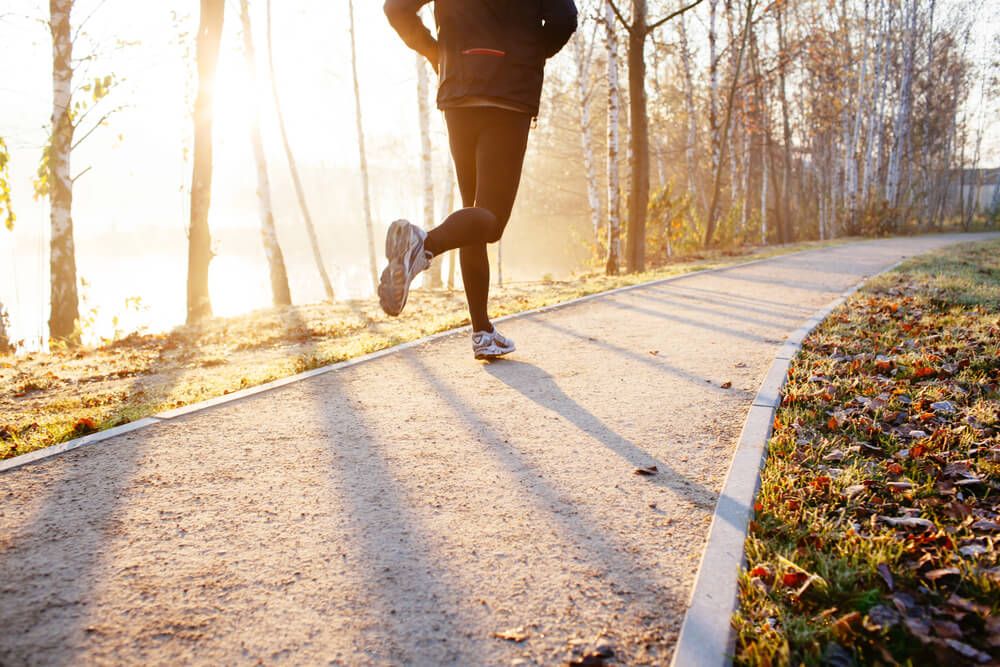 Person shown running up a path.