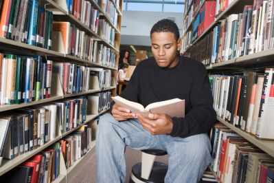 Teen Reading in Library