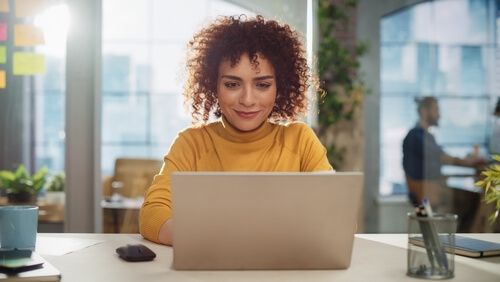 A woman using a computer for ordination purposes
