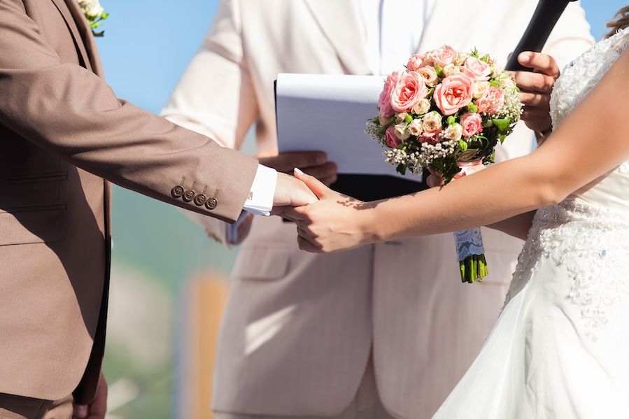 Couple holding hands during ceremony