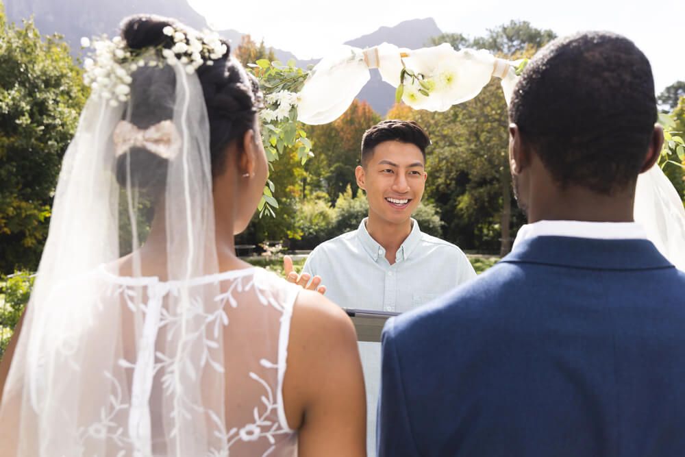 Wedding officiant greeting couple