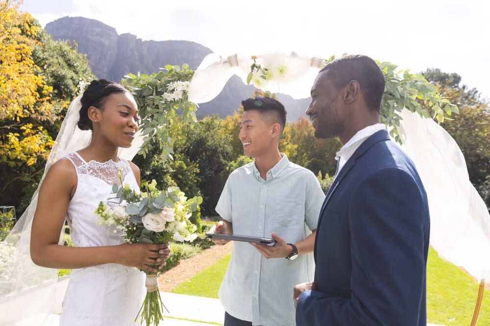 Officiant with couple getting married