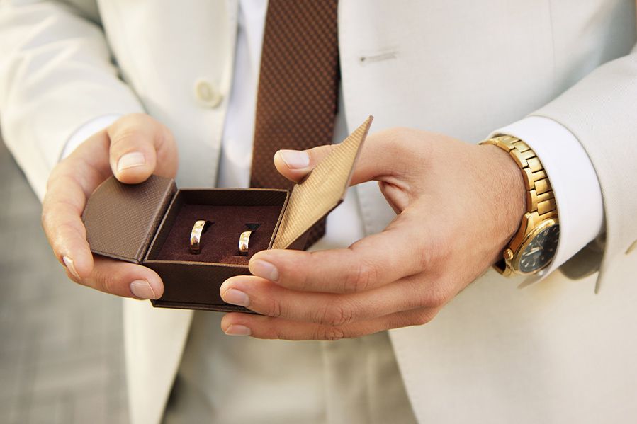 officiant holding rings during ring warming ceremony