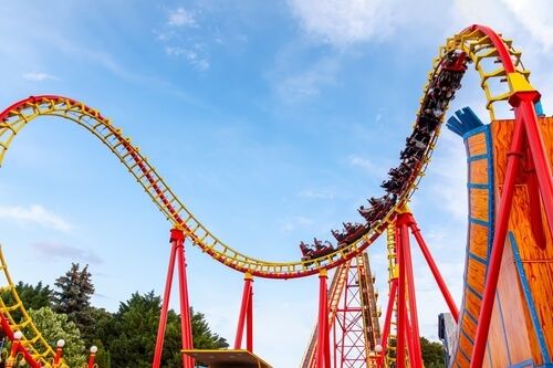 A yellow and red roller coaster as a wacky wedding venue.