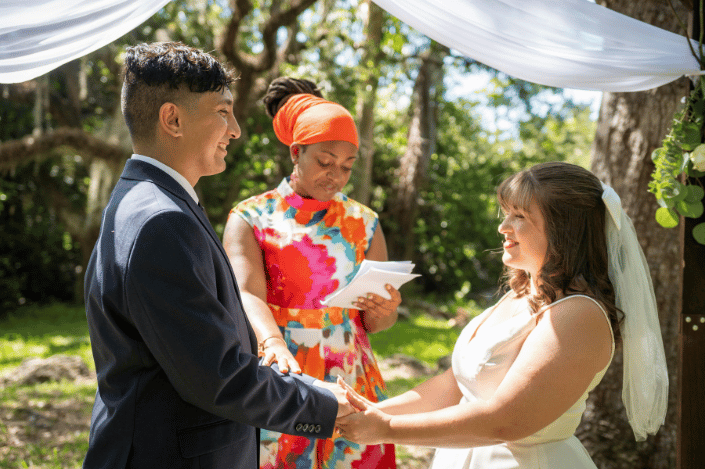 An ordained minister officiating a wedding for a couple