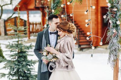 A bride and groom together at their winter wedding