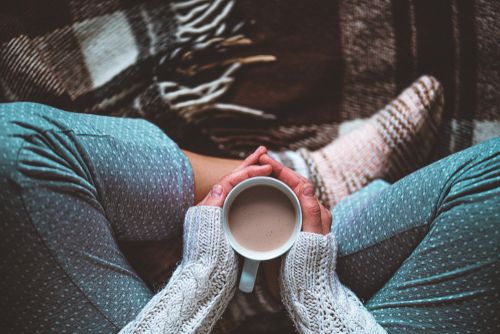 Woman At Rest With Hot Beverage