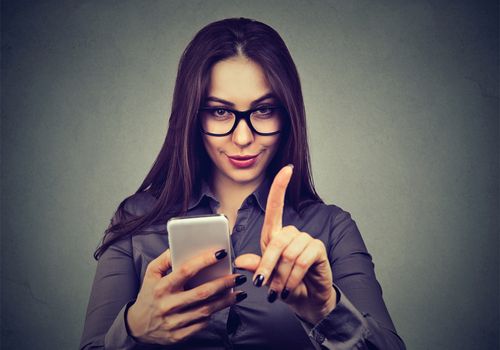 Woman Holding a Smartphone Not Doing A Digital Detox