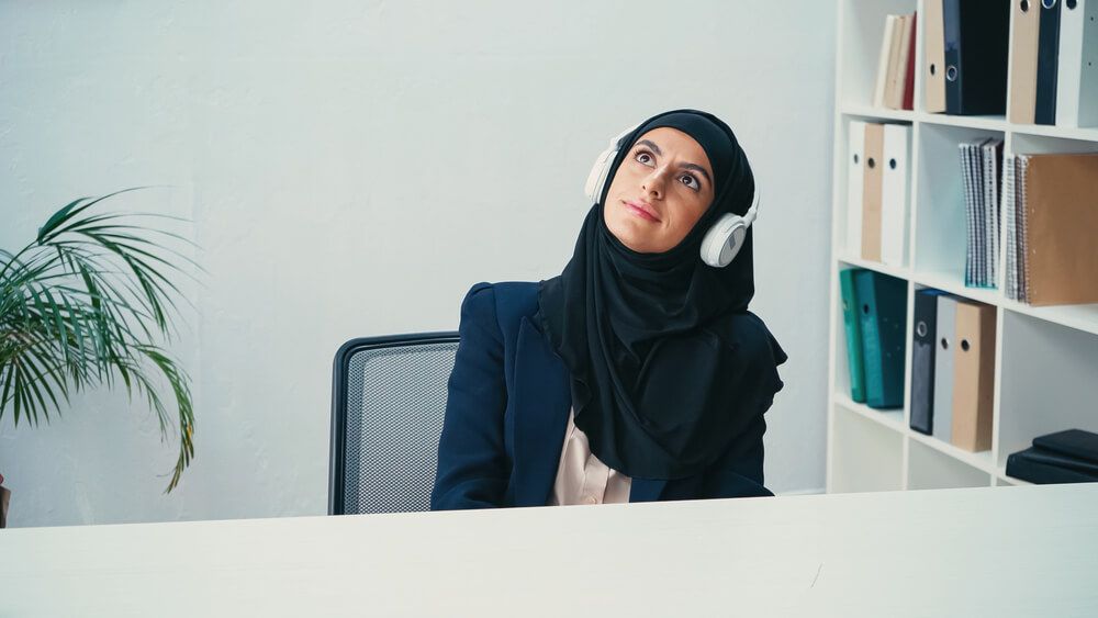 A woman listening to music on headphones