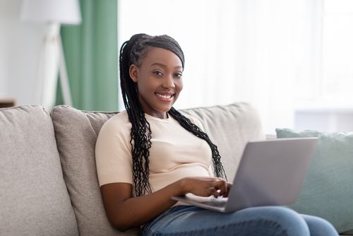 Woman on a Couch With Her Laptop