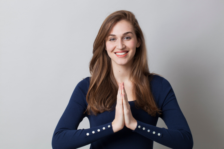 Woman pressing her hands together