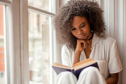 Woman Relaxing and Reading a Book
