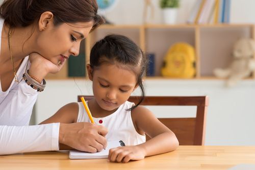 Woman Teaching a Child